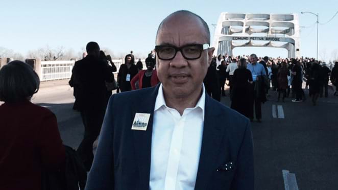 Darren Walker in front of the Edmund Pettus Bridge during the 50th anniversary of the march from Selma to Montgomery.  This image is not available under the 4.0 Creative Commons license.