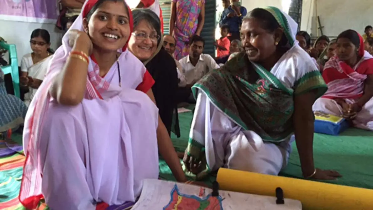 Local women explain the way the villagers have mapped their land and resources. 2015. This image is available under the 4.0 Creative Commons license.