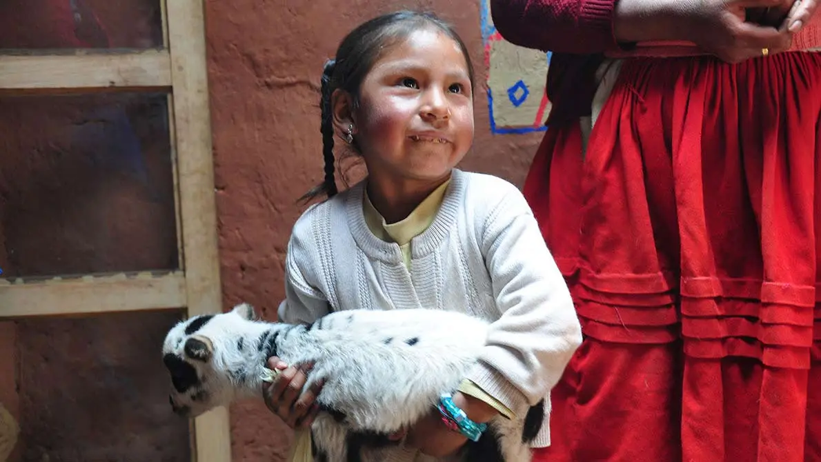 Young girl with her goat. This image is available under the 4.0 Creative Commons license.