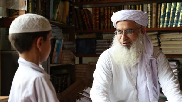 Teacher and very young student at radical Islamic school. This image is unavailable under the 4.0 Creative Commons license.