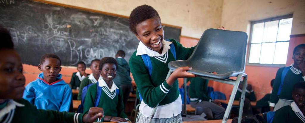 Students with items they need to learn properly: desks and chairs. This image is not available under the 4.0 Creative Commons license.