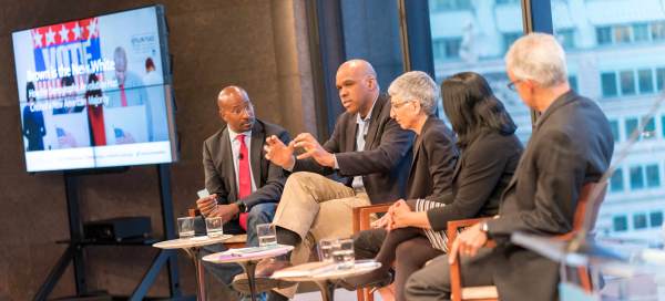 Van Jones, Steve Phillips, Tamar Jacoby, Deepa Iyer, and Ian Haney López sit on stage for a panel discussion. A TV screen behind them reads "Brown is the New White: How the Demographic Revolution Has Created A New American Majority"