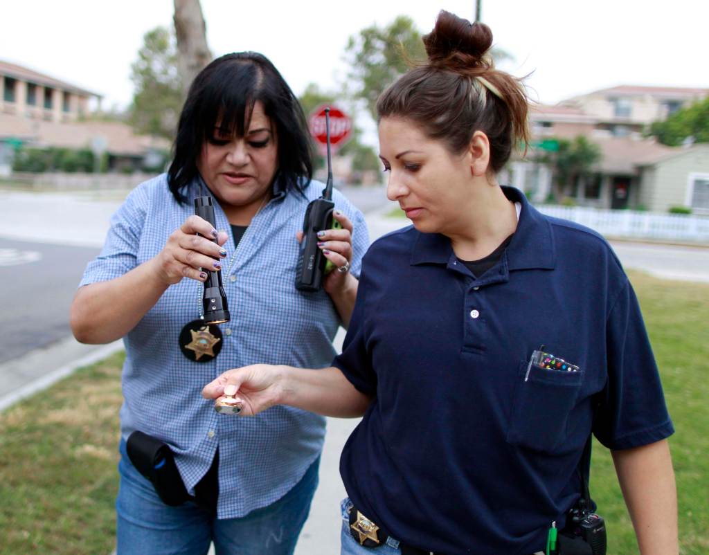 Deputy Probation Officer Christine Torres and Orange County Deputy Probation Officer Erin Merritt. REUTERS/Lucy Nicholson