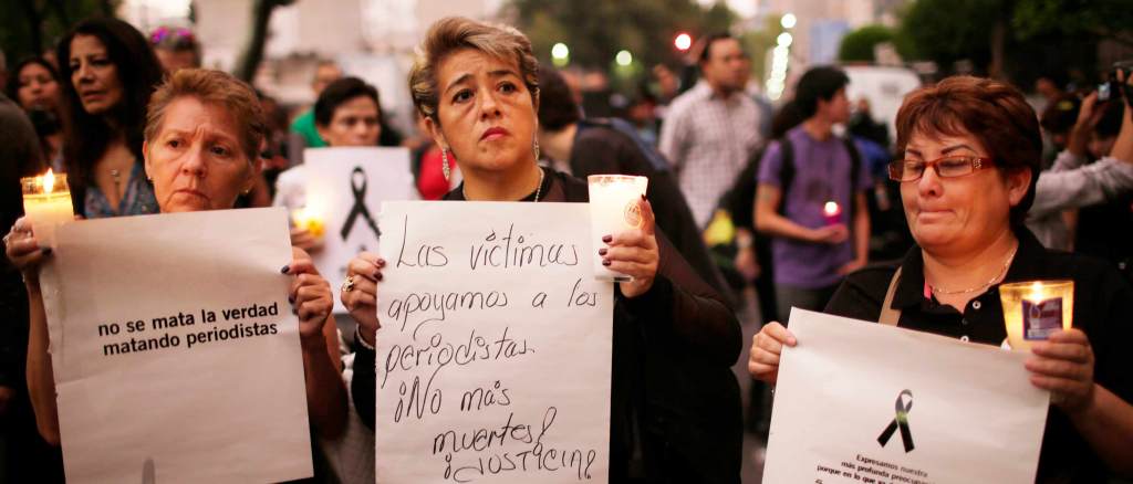 Women protesters are holding signs in Mexico city after a journalist was murdered. Credit: Miguel Tovar/STF
