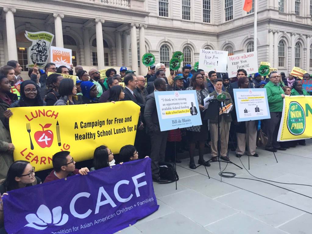 Protesters in front of New York's City Hall advocating for "Free School Lunch for All."