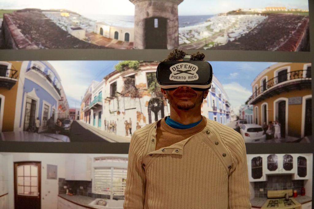 A visitor to the Caribbean Cultural Center African Diaspora Institute uses an augmented reality headset.