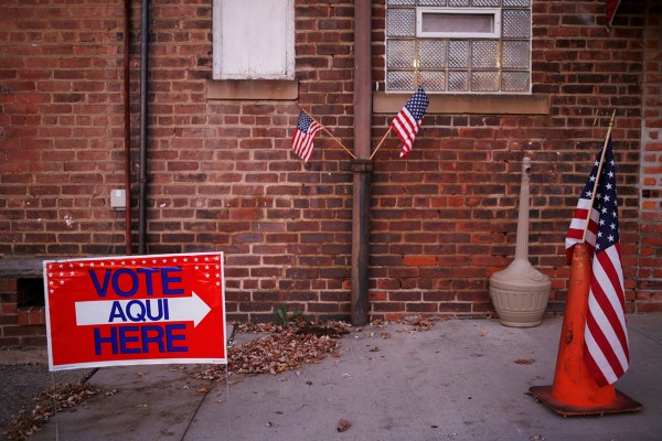 American flags are displayed outside an American Legion Post on Election Day. Photographer: Luke Sharrett/Bloomberg via Getty Images