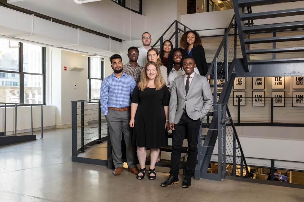 Ford Foundation interns standing on a staircase