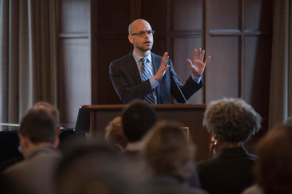 Xav Briggs speaking at a confernece.