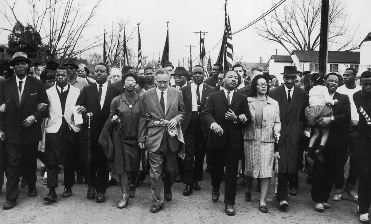 American civil rights campaigner Martin Luther King and his wife Coretta Scott King lead a black voting rights march from Selma, Alabama, to the state capital in Montgomery.