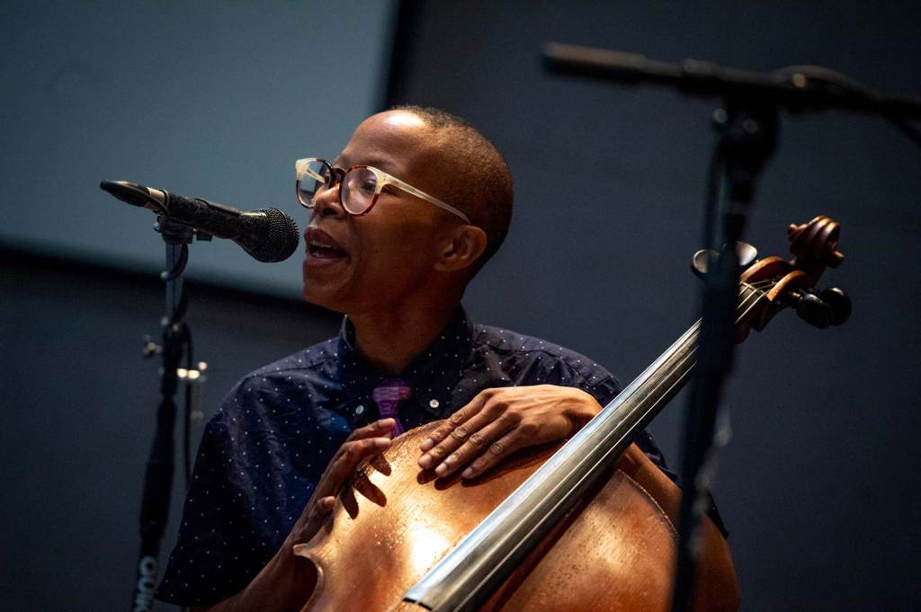 Spirit McIntyre singing and playing the cello