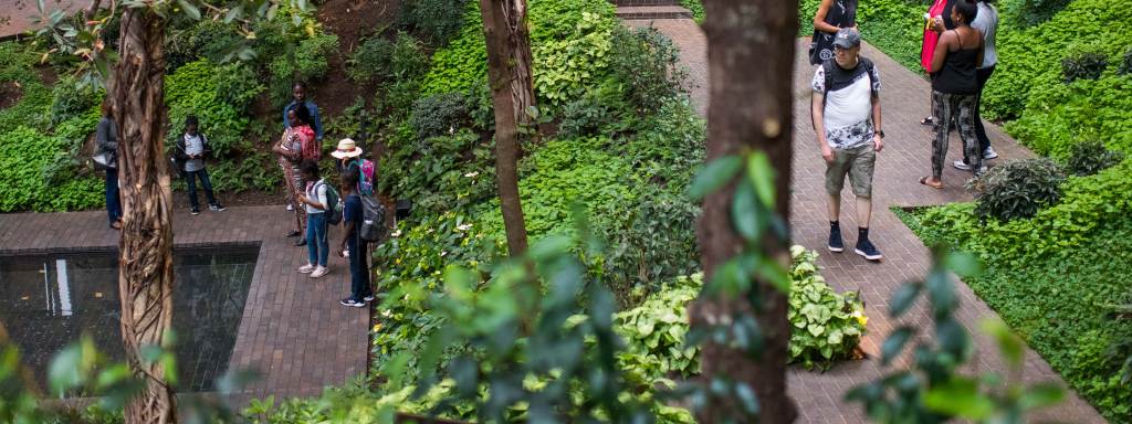 People walking in the Ford Foundation atrium garden