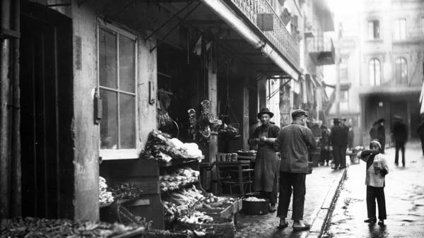 Black and white photo depicting Chinatown storefront selling meat and vegetable in San Francisco California. Date: 1895