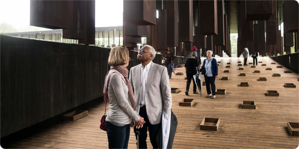 Visitors walk through an exhibit at the National Memorial for Peace and Justice  in Montgomery, Alabama.