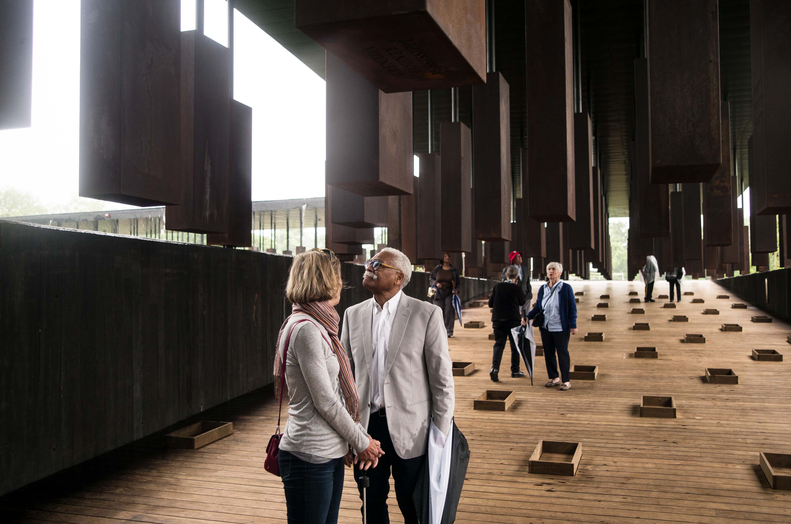 Visitors walk through an exhibit at the National Memorial for Peace and Justice  in Montgomery, Alabama.