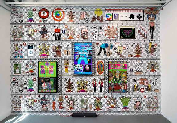 Three monitors display colorful animation and photographs of people; behind them, wallpaper features rows of lively characters and icons.