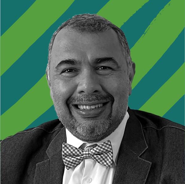 B&W Picture of Luis Francisco Cabezas against a green graphic background.