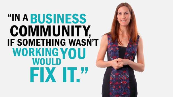 Elizabeth Swavola has long brown hair and is wearing a black dress with a  blue and red-flowered pattern. Next to her is copy that reads, "In a business community, if something wasn't working you would fix it."