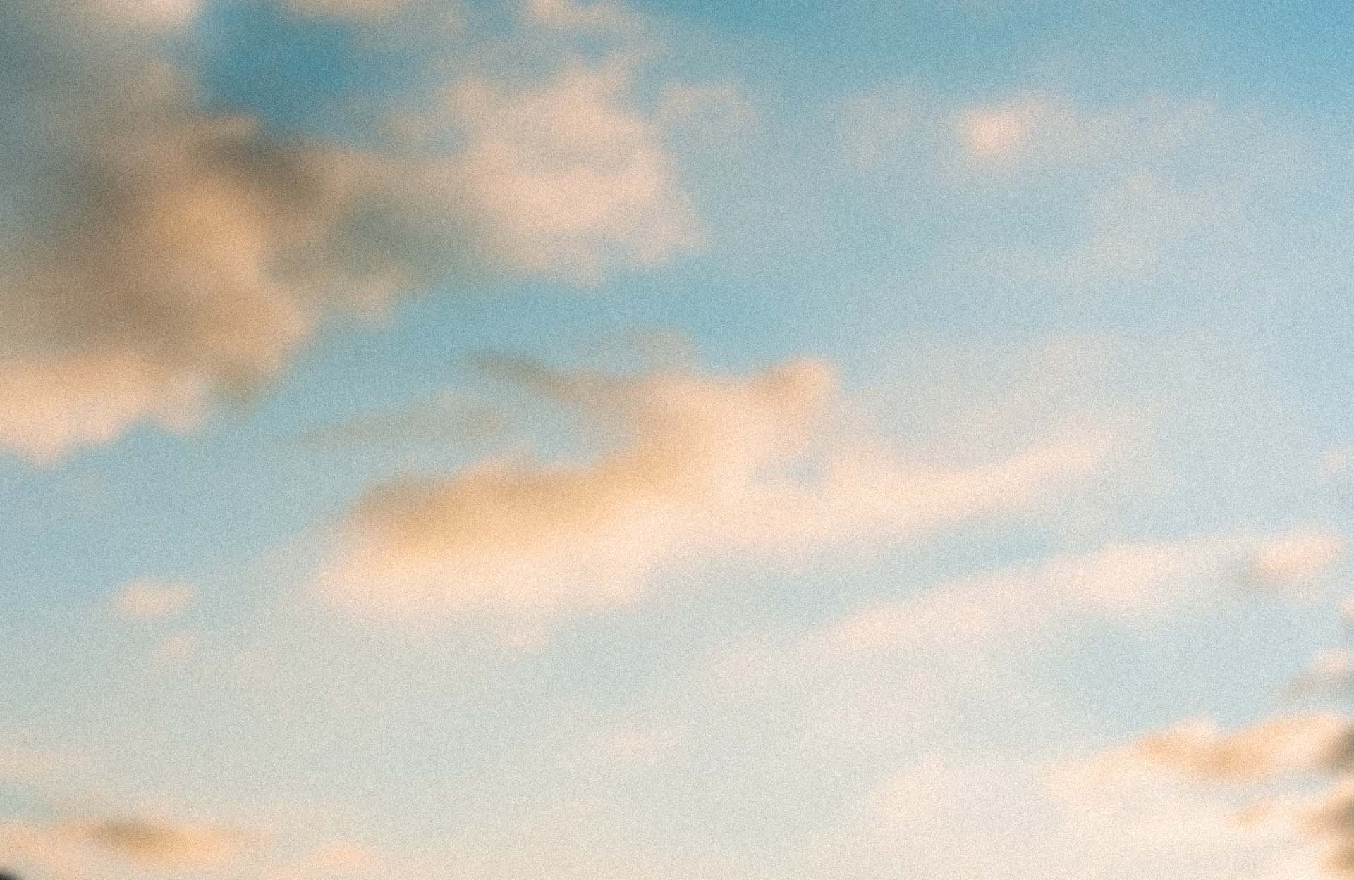 A blurred image of clouds at sunset.