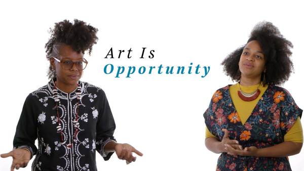 Michel de Nonó wears a black top with white embroidery and large framed eyeglasses. Lydela de Nonó wears a multicolored floral pattern top over a mustard-colored shirt and has a sizeable pendant necklace. The phrase "Art Is Opportunity" appears between them.