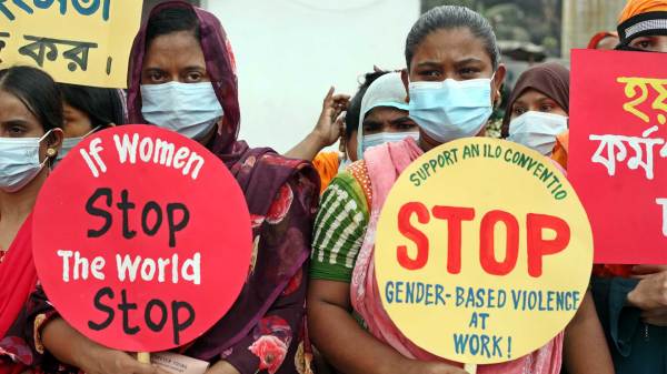 Garments factory workers take part during a protest, in front of the National Press Club.