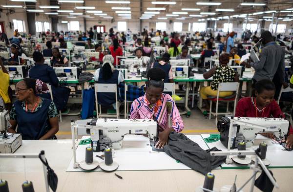 Workers sew fabric at a DTRT apparel factory. DTRT is the largest commercial fabric manufacture in West Africa with multiple factories employing thousands of people. It gets the fabric from China and exports the clothing to the United States and Europe.