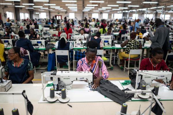 Workers sew fabric at a DTRT apparel factory. DTRT is the largest commercial fabric manufacture in West Africa with multiple factories employing thousands of people. It gets the fabric from China and exports the clothing to the United States and Europe.