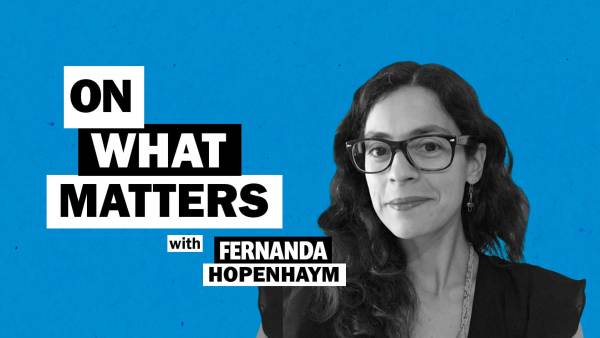 Fernanda Hopenhaym has long wavy black hair and is wearing a black top and wearing dark rimmed eye glasses. To her left appears the text: On what matters with Fernanda Hopenhaym.