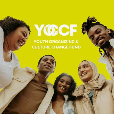 A group shot of young people against a yellow background with the YOCCF logo.