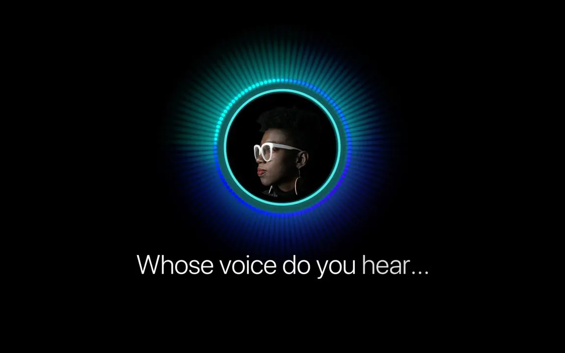 Digital image on a black background with a circular headshot surrounded by a border of colorful light rays. There is captioning at the bottom of the screen which reads “Whose voice do you hear…”