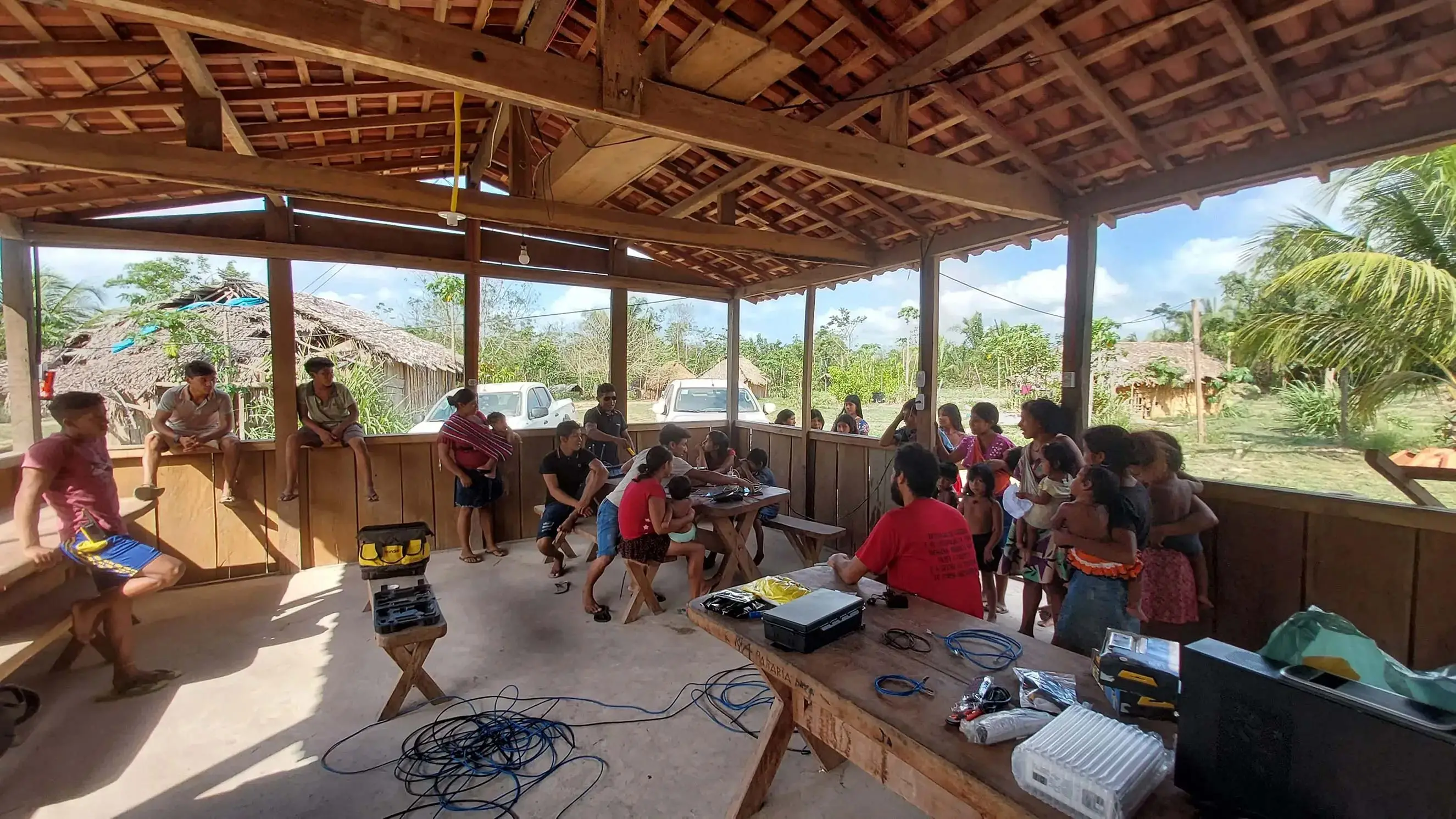 NUPEF workers helping to set up internet cables in a quilombola in Brazil.