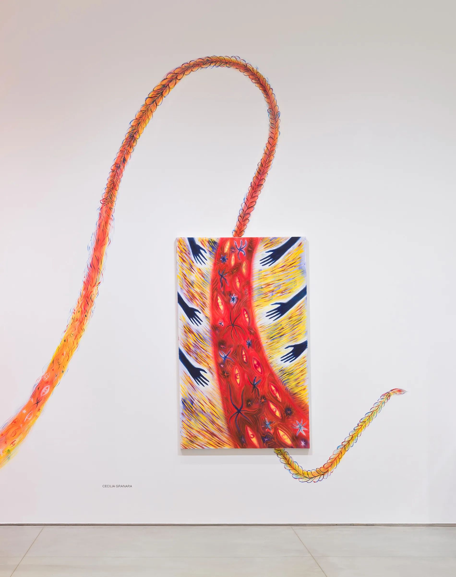 Abstract wall painting resembling a partially braided band of fire.