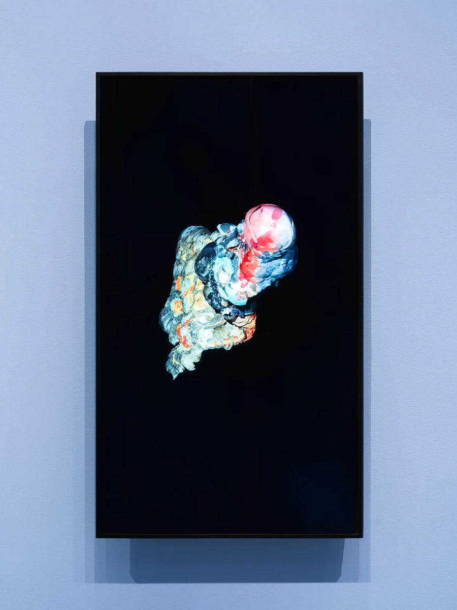 A lumpy amorphous form, approximately shaped like a round-edged diamond, on a black background.