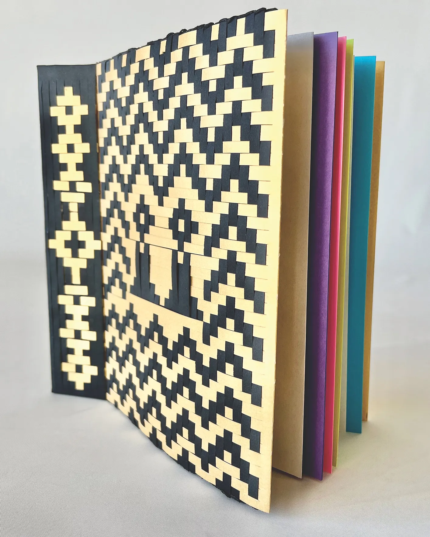Bound sketchbook with woven paper cover.