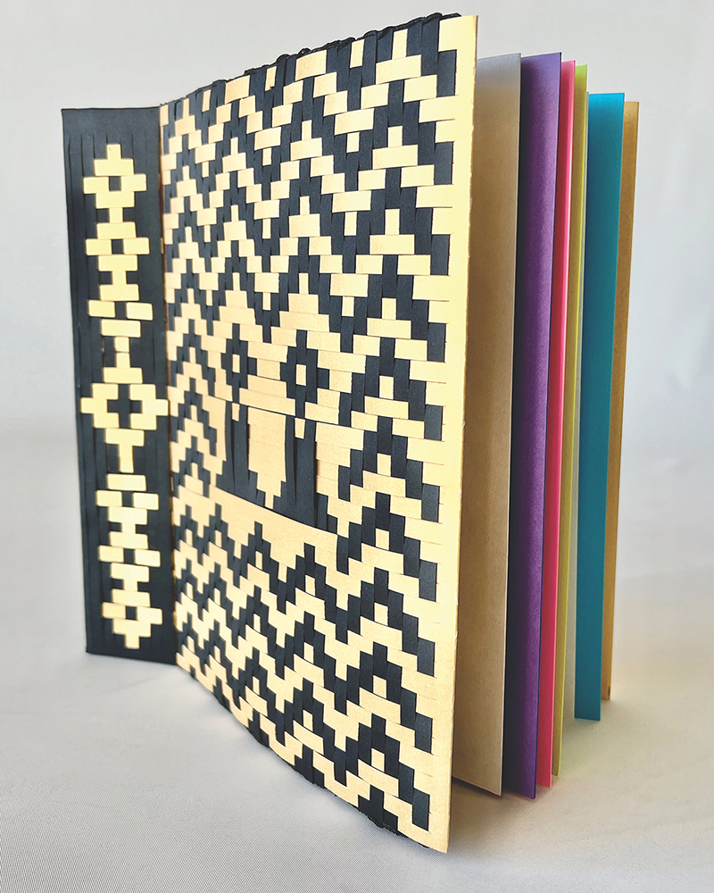 Bound sketchbook with woven paper cover.