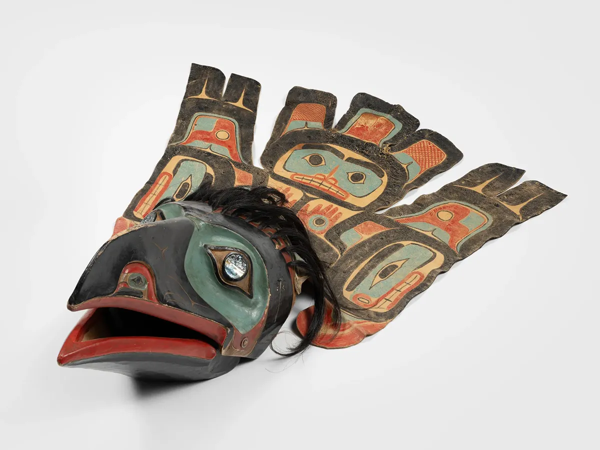 Bird shaped mask with painted details.
