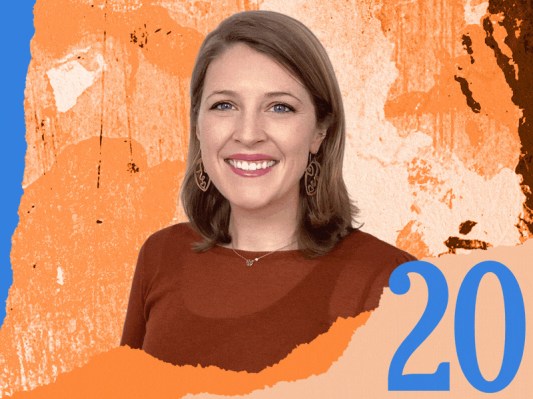 A woman stands against an orange and blue background, featuring the number 20 prominently displayed.