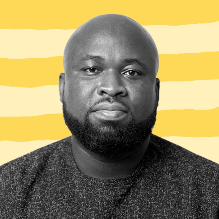B&W Picture of Kodzo Yaotse against a light and dark yellow graphic background.
