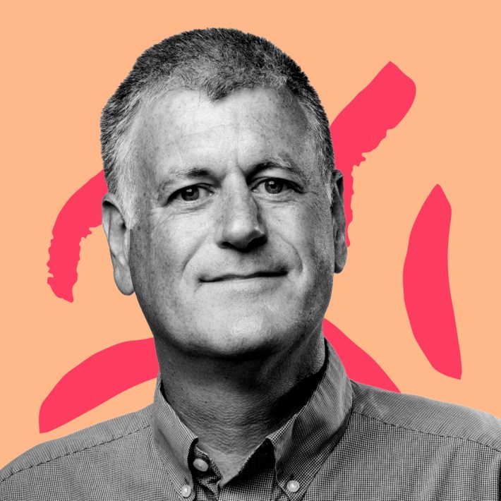 B&W Picture of Dr. Troy Jackson against a peach and magenta graphic background.