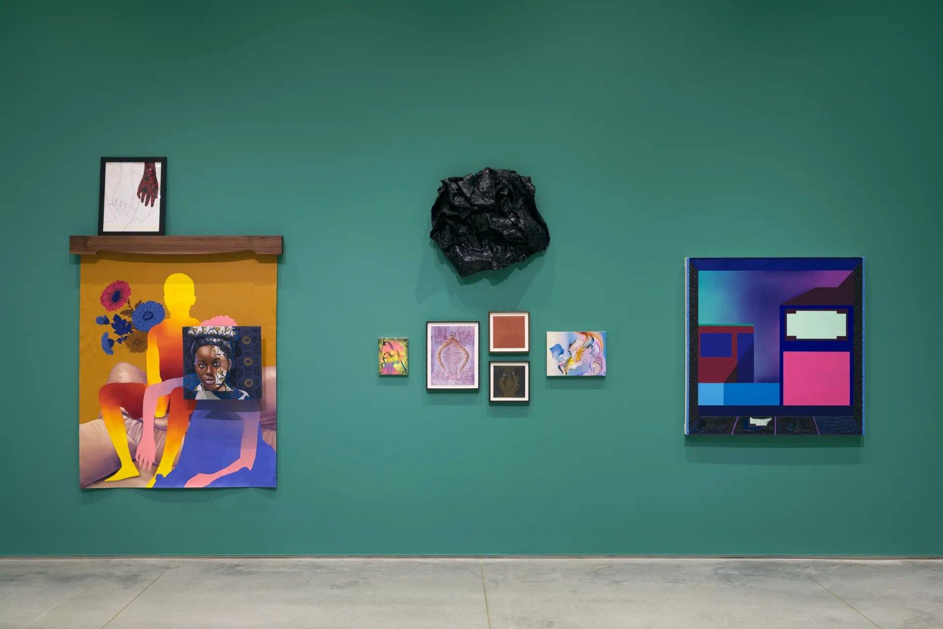 A gallery wall with multi-media artworks of vibrant colors.