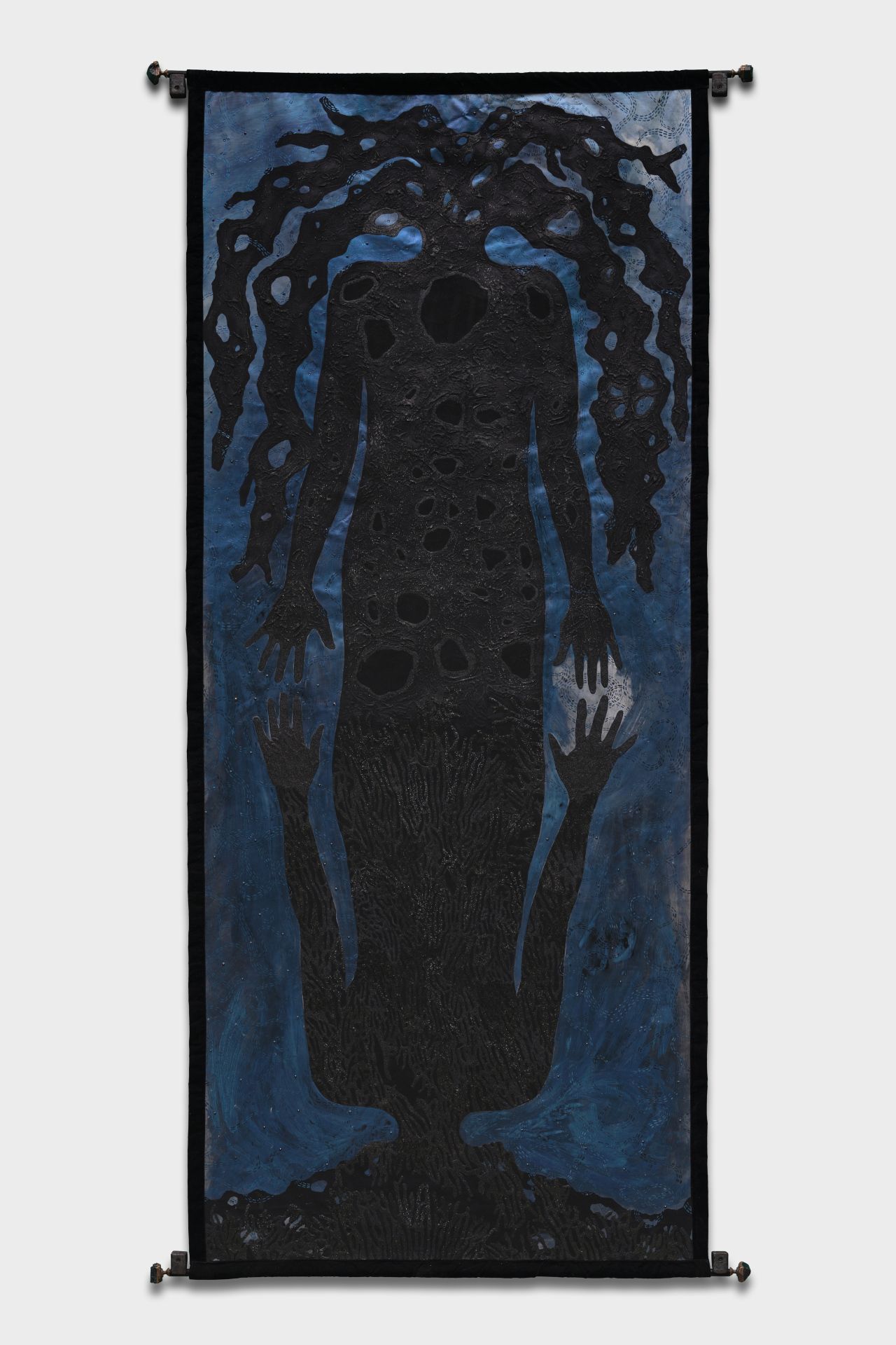 A painting on linen of a human silhouette that is mirrored at the waist so that one half of the body is upside right and the other is upside down. Both figures have tree root-like shapes instead of heads