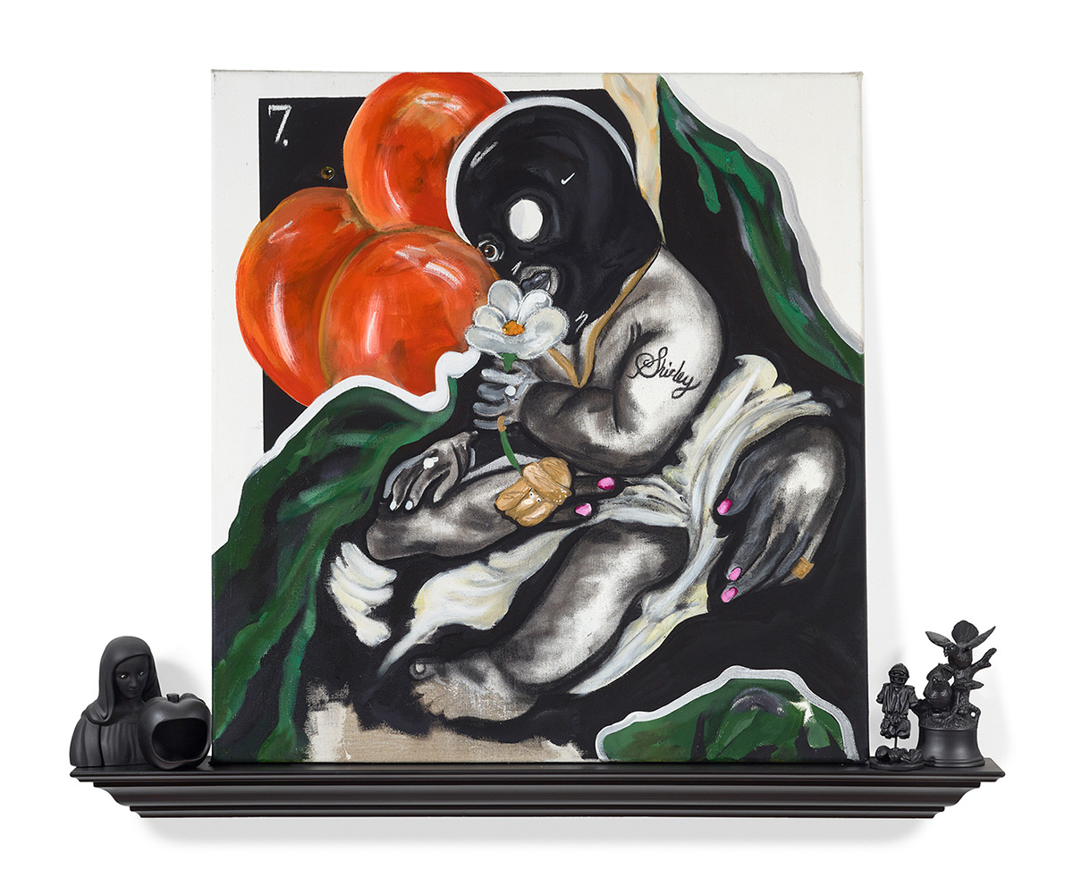 A painting of hands holding a baby wearing a ski mask, whose arm is tattooed with the name “Shirley”. The painting sits on top of a shelf with other various statuettes.