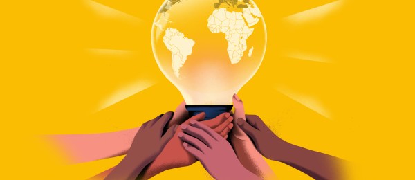 A stylized illustration of a stack of hands of various skin tones holding up a glowing lightbulb. The lightbulb's filament is a map of the world, and it emits bright yellow light rays against a yellow background.
