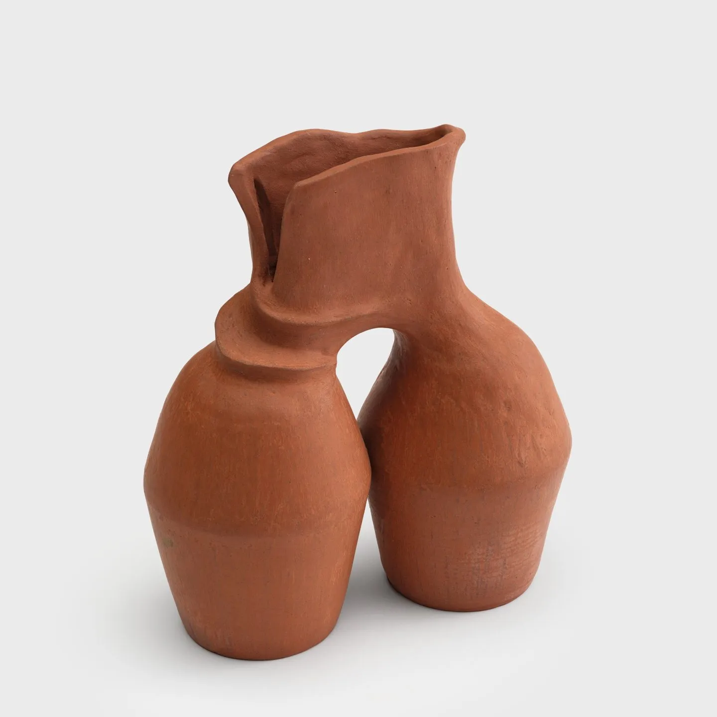 A small ceramic vase with two barrel-shaped bodies connecting at a shared flared neck with stretched lumpy grooves where hands manipulated the clay.