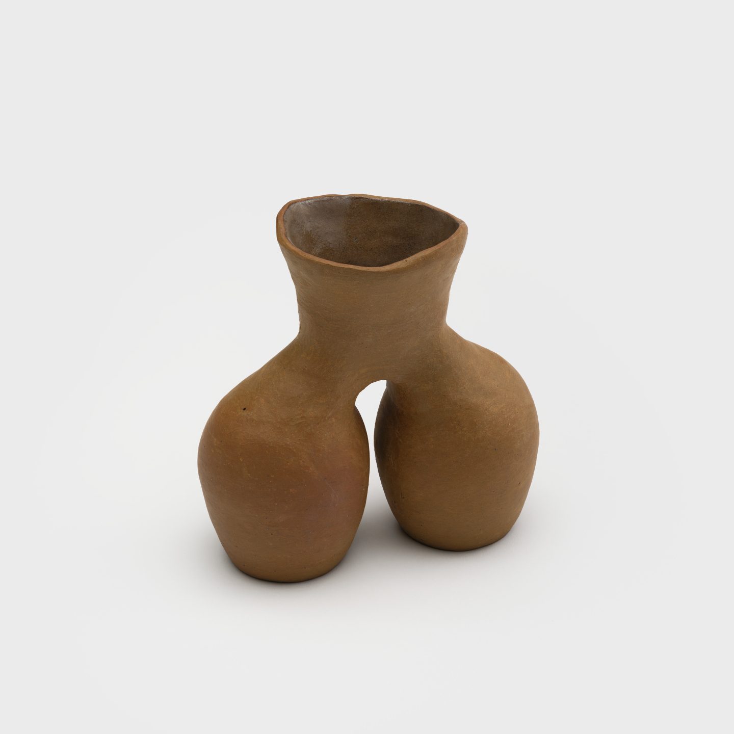 A small ceramic vase with two oval-shaped bodies connecting at a shared flared neck.