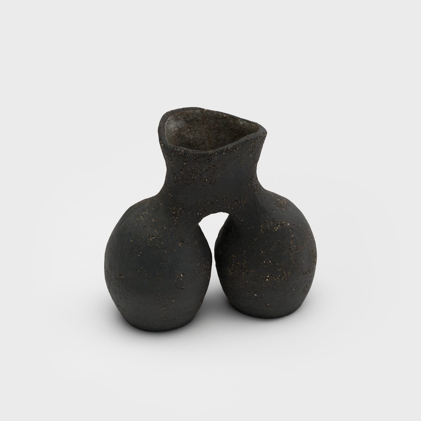 A small ceramic vase with two oval-shaped bodies connecting at a shared flared neck.