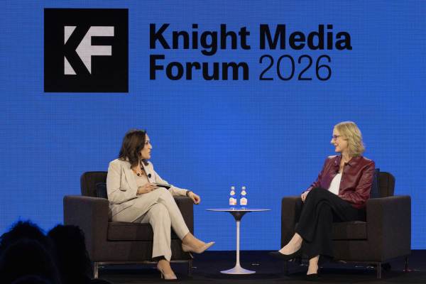 Two women, Maribel Pérez Wadsworth (left) and Heather Gerken (right), engage in a fireside chat at the Knight Media Forum 2026. Seated in grey armchairs against a vibrant blue backdrop with the "KF" logo, they discuss the future of journalism and media leadership.