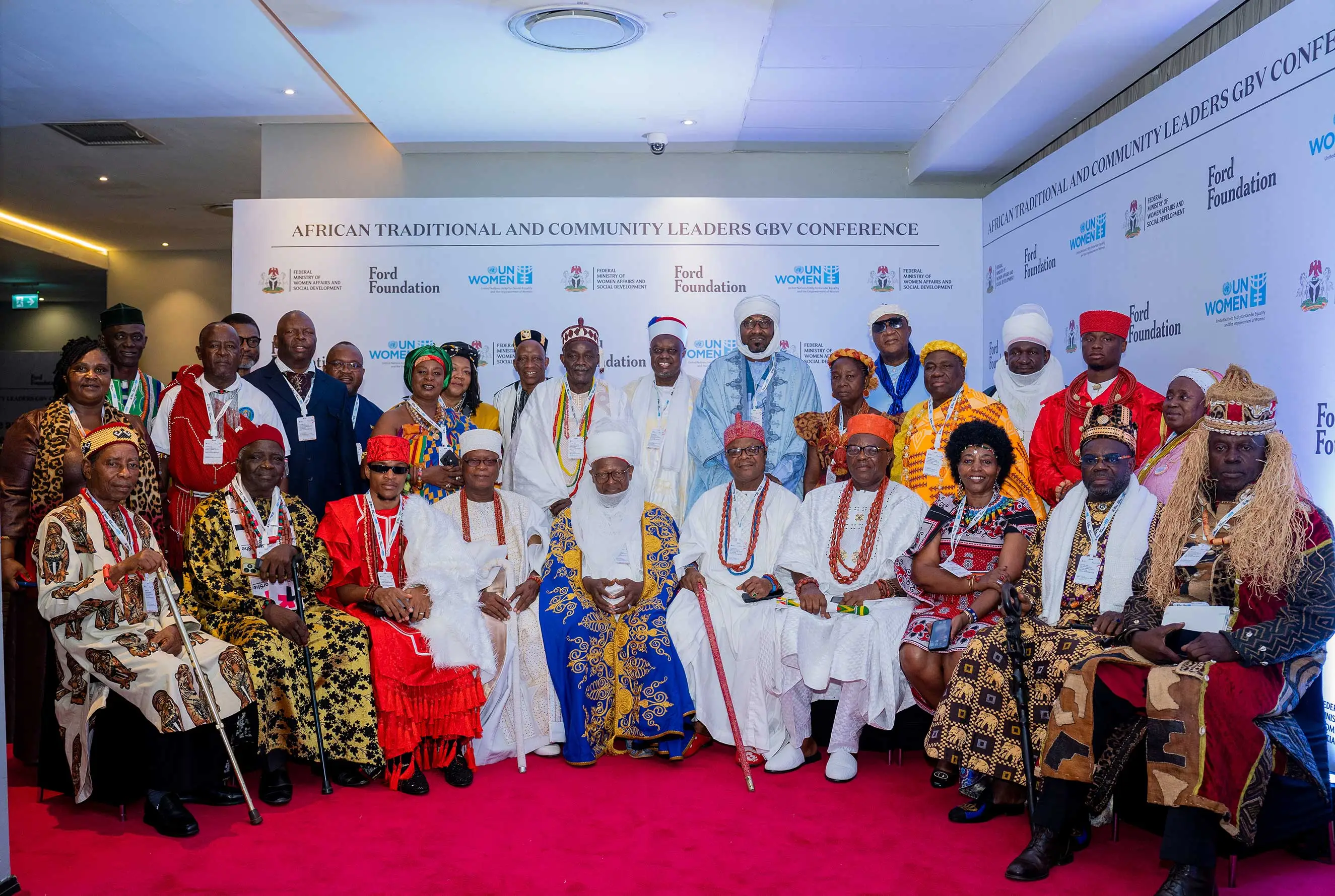 A group portrait of traditional and community leaders in vibrant, ceremonial attire at the African Traditional and Community Leaders GBV Conference. This image represents cultural leadership, advocacy against gender-based violence, and strategic partnerships with the Ford Foundation and UN Women.