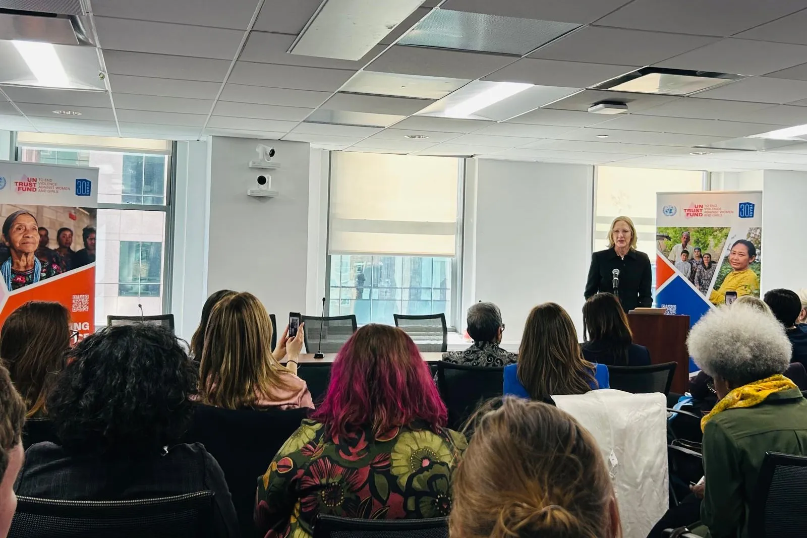 Heather Gerken delivers a keynote address at a UN Trust Fund to End Violence Against Women event during the Commission on the Status of Women (CSW). She speaks from a podium to an engaged audience, emphasizing global gender justice and advocacy.