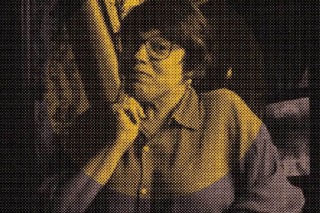 Pixelated image of Judy Heumann with an orange circled overlayed on it.